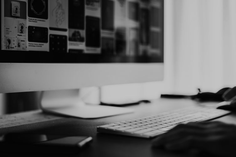 man working on a computer desk